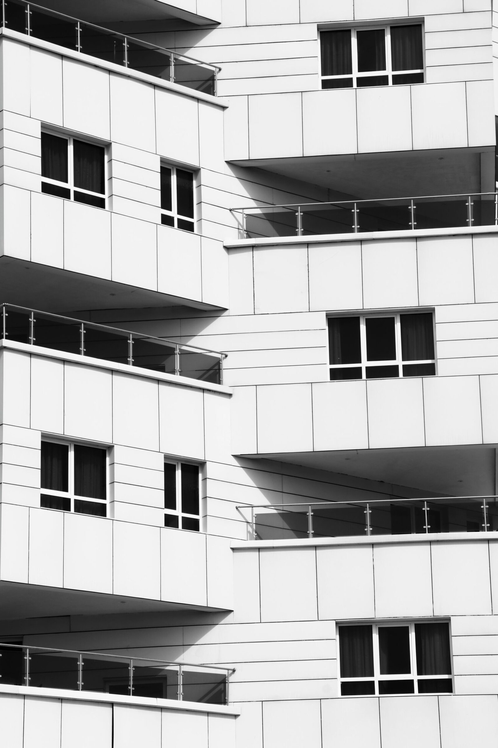 a black and white photo of a building with windows